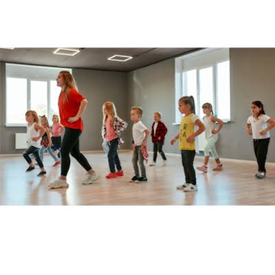 Kids following an instructor in a group freestyle dance class in Chiang Mai